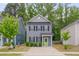 Charming two-story home with a well-manicured lawn, a bright green door, and a concrete driveway at 138 Yellow Jacket Rdg, Clayton, NC 27520