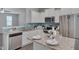 Gorgeous kitchen with granite countertops, a stainless steel dishwasher, and modern fixtures at 138 Yellow Jacket Rdg, Clayton, NC 27520