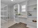 Well-organized laundry room with bright lighting and ample shelving for storage at 138 Yellow Jacket Rdg, Clayton, NC 27520