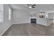 Spacious living room with grey wood floors, a fireplace, and plenty of natural light, offering a cozy atmosphere at 138 Yellow Jacket Rdg, Clayton, NC 27520