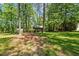 Outdoor area with a picnic shelter surrounded by mature trees at 1414 Walter Bright Rd, Sanford, NC 27330