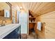 Renovated bathroom features a modern vanity, shower, and stylish finishes at 1414 Walter Bright Rd, Sanford, NC 27330