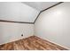 Cozy bedroom features wood-look floors and neutral walls at 1414 Walter Bright Rd, Sanford, NC 27330