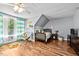 Charming bedroom with hardwood floors, a cozy bed, and bright natural light from the window at 1414 Walter Bright Rd, Sanford, NC 27330