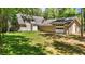 Exterior of the house and detached garage surrounded by a well-manicured lawn at 1414 Walter Bright Rd, Sanford, NC 27330