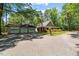 Spacious home with detached garage on a large lot, surrounded by mature trees at 1414 Walter Bright Rd, Sanford, NC 27330