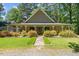 Charming single-story home featuring a welcoming front porch and well-maintained landscaping at 1414 Walter Bright Rd, Sanford, NC 27330
