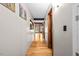 Bright hallway with hardwood floors and wall art leading to other areas of the house at 1414 Walter Bright Rd, Sanford, NC 27330