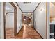Well-lit hallway with wood floors, connecting various rooms, and ample lighting at 1414 Walter Bright Rd, Sanford, NC 27330