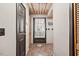 Hallway featuring tile flooring and access to multiple rooms at 1414 Walter Bright Rd, Sanford, NC 27330
