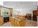 Bright kitchen showcasing an island with granite countertop, wooden cabinets and an open layout at 1414 Walter Bright Rd, Sanford, NC 27330