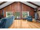 Bright living room with hardwood floors, wood paneled walls and a fireplace at 1414 Walter Bright Rd, Sanford, NC 27330