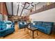 Open living room with exposed beam vaulted ceiling and a cozy seating area at 1414 Walter Bright Rd, Sanford, NC 27330