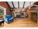 Cozy living room with wood paneled walls, fireplace, and a spiral staircase at 1414 Walter Bright Rd, Sanford, NC 27330