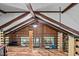 Open loft with wooden beams and railing overlooking the living room, offering ample light at 1414 Walter Bright Rd, Sanford, NC 27330