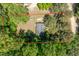 Aerial view of a house surrounded by lush trees in a large yard at 145 Mark St, Franklinton, NC 27525