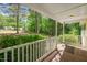 This covered back porch overlooks a treed lot at 145 Mark St, Franklinton, NC 27525