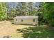 Aerial view of a private backyard shows the yard and back of the home at 145 Mark St, Franklinton, NC 27525