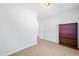 Carpeted bedroom features neutral walls, a large bookcase and doorway at 145 Mark St, Franklinton, NC 27525