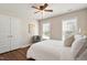 Comfortable bedroom featuring neutral colors, wood floor, and natural light from two windows at 1601 Glazebrook Dr, Wake Forest, NC 27587