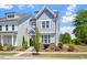 Charming two-story home featuring a welcoming front porch and beautifully landscaped yard at 1601 Glazebrook Dr, Wake Forest, NC 27587