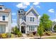 Charming two-story home featuring a welcoming front porch and beautifully landscaped yard at 1601 Glazebrook Dr, Wake Forest, NC 27587