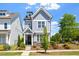 Charming two-story home featuring a welcoming front porch and beautifully landscaped yard at 1601 Glazebrook Dr, Wake Forest, NC 27587