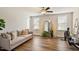 Spacious living room area featuring hardwood floors, and comfortable seating with natural light at 1601 Glazebrook Dr, Wake Forest, NC 27587
