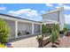 Attractive outdoor patio featuring a dining set and a seating area surrounded by lush landscaping at 1601 Glazebrook Dr, Wake Forest, NC 27587
