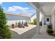 Charming patio with Adirondack chairs, complemented by well-maintained landscaping at 1601 Glazebrook Dr, Wake Forest, NC 27587