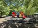 Fun playground area with slides and climbing structures, nestled among mature trees at 1601 Glazebrook Dr, Wake Forest, NC 27587
