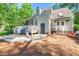 Backyard view with deck, grill, and door to the main house at 1712 Briarforest Pl, Raleigh, NC 27615