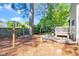 Backyard showing a deck with grill and a fenced yard at 1712 Briarforest Pl, Raleigh, NC 27615
