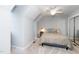 Cozy bedroom featuring neutral walls, a ceiling fan, and comfortable bedding for a serene retreat at 1712 Briarforest Pl, Raleigh, NC 27615