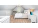 Bright bedroom features neutral decor, a window with natural light, and carpet flooring at 1712 Briarforest Pl, Raleigh, NC 27615