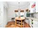 Cozy breakfast nook features a bay window, built-in seating and terracotta floors at 1712 Briarforest Pl, Raleigh, NC 27615