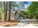 Spacious driveway leading to a charming home with a well-maintained yard at 1712 Briarforest Pl, Raleigh, NC 27615