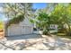 Attached two car garage with driveway and charming home exterior at 1712 Briarforest Pl, Raleigh, NC 27615