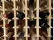 Close up of customized wine storage racks in wine cellar at 1712 Briarforest Pl, Raleigh, NC 27615