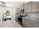Well-appointed kitchen features granite countertops, stainless steel appliances, and ample cabinet space at 187 Curling Creek Dr # 298P, Clayton, NC 27527
