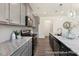 Modern kitchen featuring granite countertops, stainless steel appliances, and stylish gray cabinetry at 187 Curling Creek Dr # 298P, Clayton, NC 27527