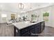 Modern kitchen with a large island, stainless steel appliances, and open layout at 187 Curling Creek Dr # 298P, Clayton, NC 27527