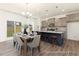 Bright kitchen and dining space with stainless steel appliances and large windows overlooking the backyard at 187 Curling Creek Dr # 298P, Clayton, NC 27527