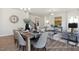 Inviting living room and dining space with hardwood floors, neutral decor, and ample natural light at 187 Curling Creek Dr # 298P, Clayton, NC 27527