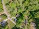 Aerial view of residential neighborhood, houses, and surrounding green trees at 200 Weybossett Rd, Henderson, NC 27537