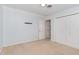 This bedroom has neutral carpet and paint with a double closet and an extra storage space at 200 Weybossett Rd, Henderson, NC 27537
