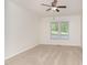 Bedroom with neutral paint, a ceiling fan, and carpeted floors, offering a bright and comfortable atmosphere at 200 Weybossett Rd, Henderson, NC 27537