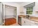 Kitchen with granite countertops, stainless steel appliances, and a sink below a window at 200 Weybossett Rd, Henderson, NC 27537