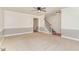 Spacious living room with carpet, stairs, and natural light at 200 Weybossett Rd, Henderson, NC 27537