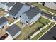 Aerial view of a home with a fenced backyard, detached garage, and proximity to amenities at 201 Annabelle Blue Drive, Wake Forest, NC 27587